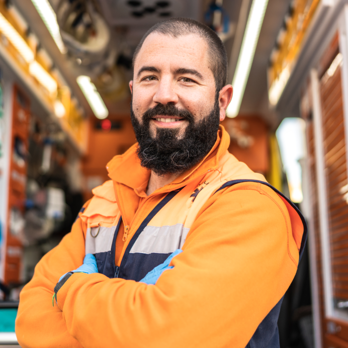 Emergency service worker standing outside an ambulance