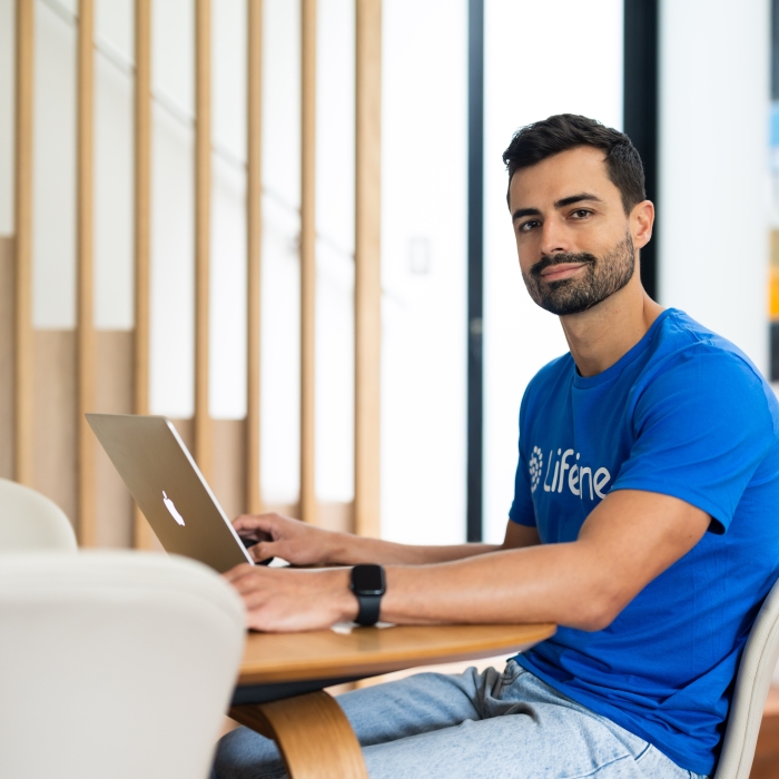 Lifeline branded image – Male crisis Supporter sitting at a desk