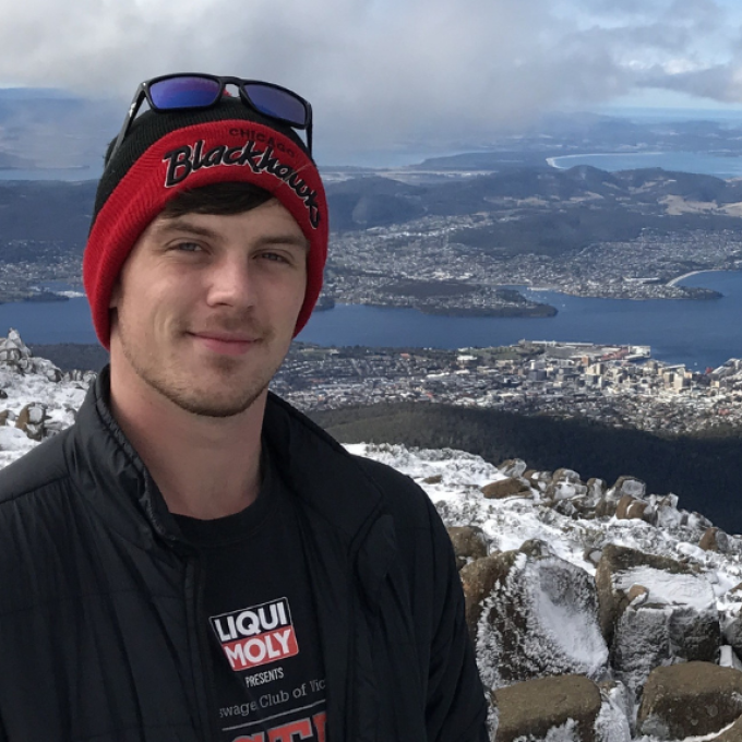 Will standing infront of oceanside view